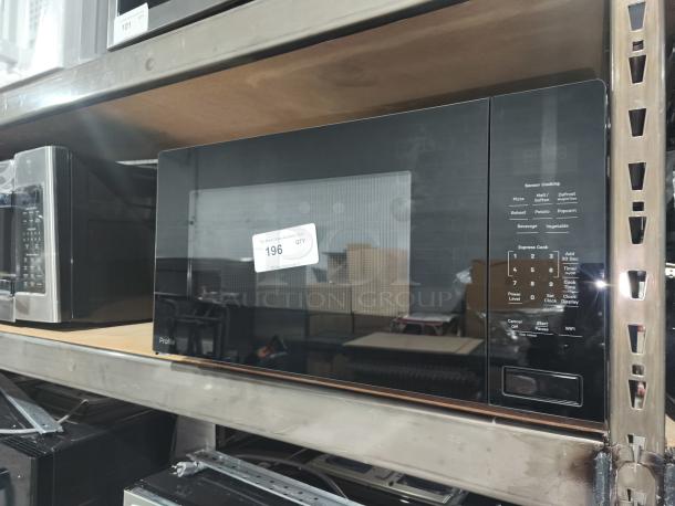 BRAND NEW GE Profile 2.2 Cu. Ft. Microwave, model PCWK22U1WBB, built-in sensor, black finish, minor scratches, auction tag 196.
