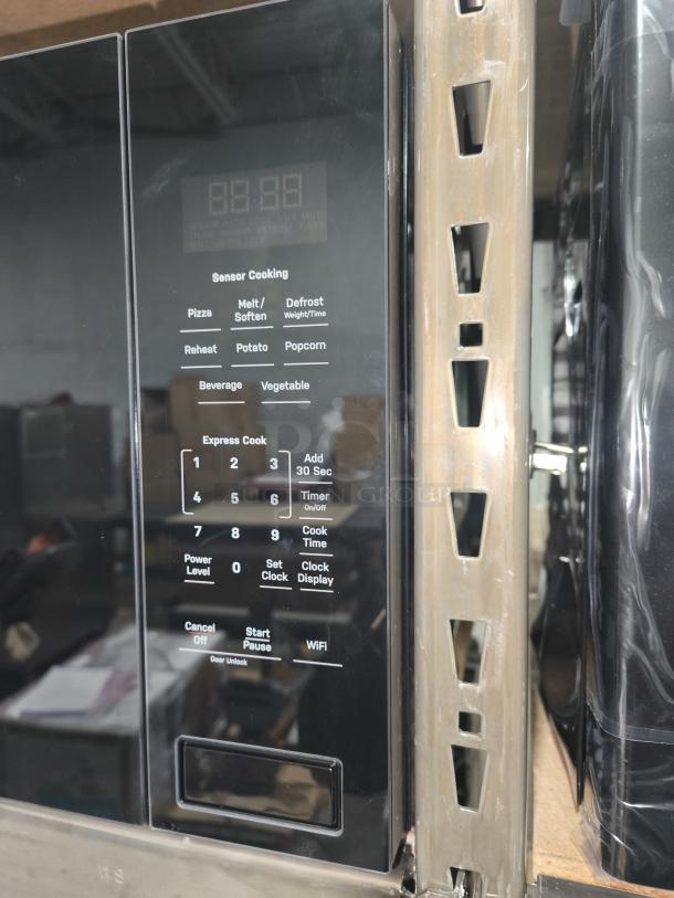 GE Profile 2.2 Cu. Ft. Built-In Sensor Microwave, model PCWK22U1WBB, new with minor scratches, keypad visible.