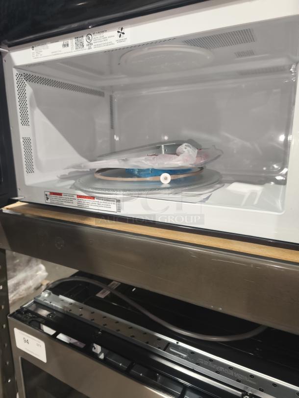 BRAND NEW GE 1.6 cu. ft. Over-the-Range Microwave JNM3163RJ6SS with recirculating venting, labeled, slight scratches.