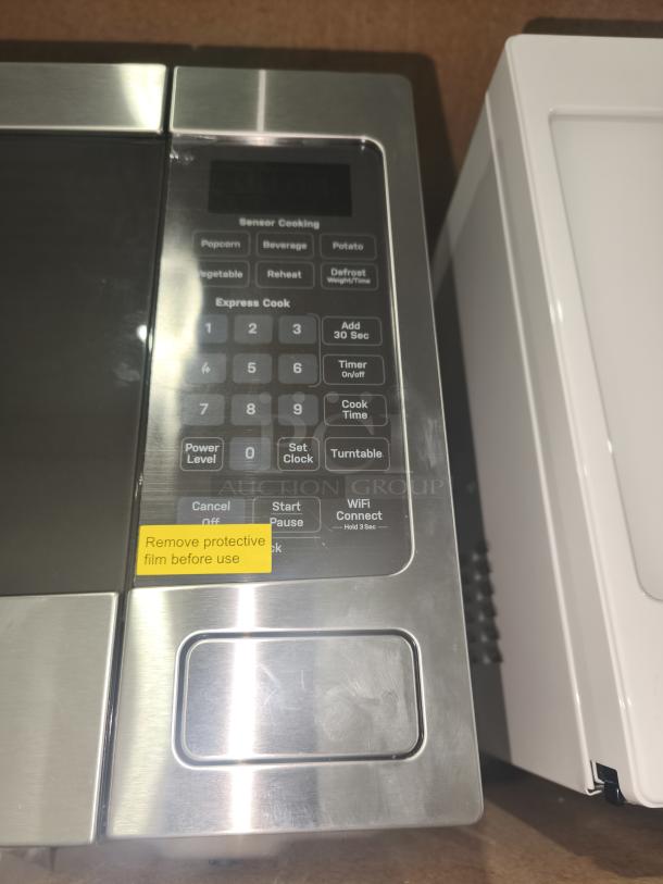 BRAND NEW GE Profile™ 1.1 cu. ft. Countertop Microwave, model PCHK11S1WSS, sensor cooking, stainless finish, scratch and dent item.