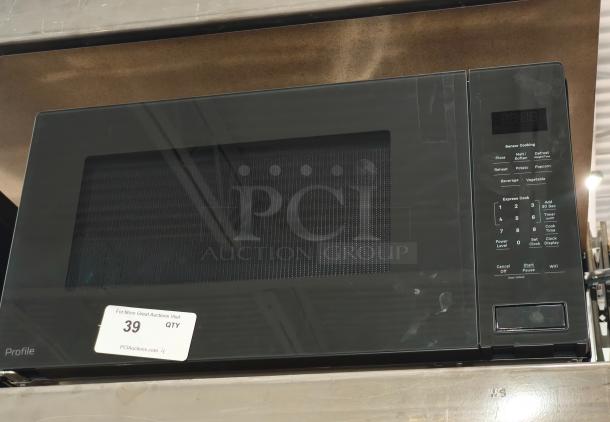 BRAND NEW GE Profile 2.2 cu ft built-in microwave, model PCWK22U1WDD. Scratch and dent condition with control panel visible.