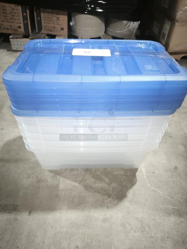 IRIS Buckle Up 12.9 Qt Storage Box, stack of blue-lid clear containers, new condition, warehouse setting.