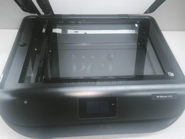 HP OfficeJet 5258 Color Inkjet All-in-One Printer, new condition, open scanner lid, model label visible.