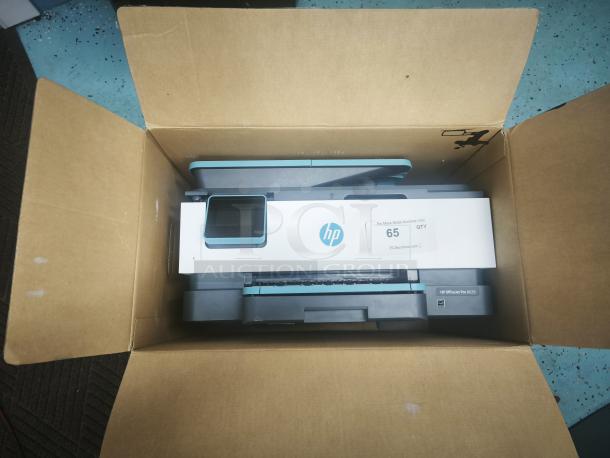 Brand new HP OfficeJet Pro 8028 printer in box, with label "For More Great Auctions Visit" and quantity "65."