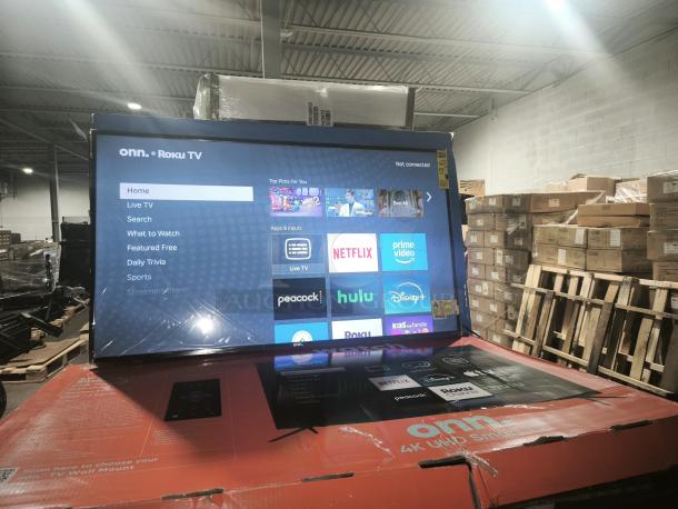 ONN 50” 4K UHD LED Roku Smart TV, model 100012585, new condition, shows streaming apps menu.