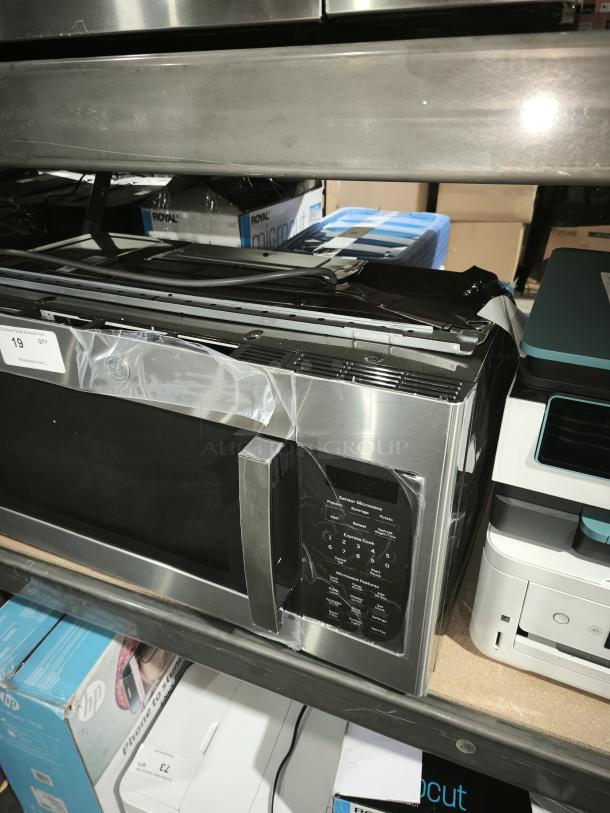 BRAND NEW GE 1.7 cu ft Over-the-Range Microwave, Model JVM6175SK6SS, stainless steel, sensor controls, slight scratches.