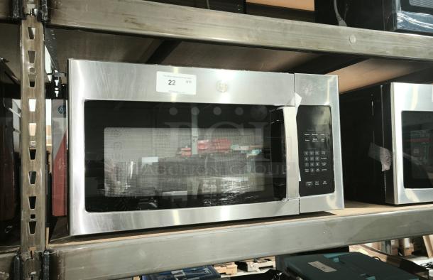 BRAND NEW GE 1.6 cu ft Over-the-Range Microwave Oven, Model PVM9005SJ8SS, stainless steel, visible scratch and dent.