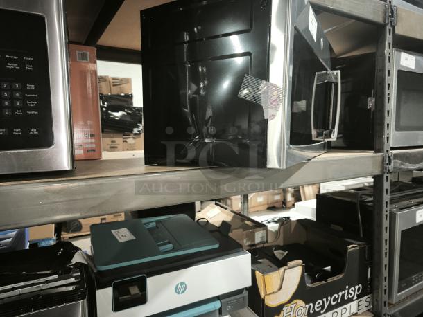 BRAND NEW GE 1.6 cu ft Over-the-Range Microwave Model PVM9005SJ8SS, slight dents visible, with handle and control panel.