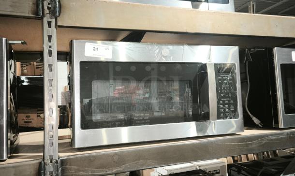 GE 1.7 cu ft Over-the-Range Sensor Microwave, model JVM6175SK6SS, brand new with minor dents. Silver finish.
