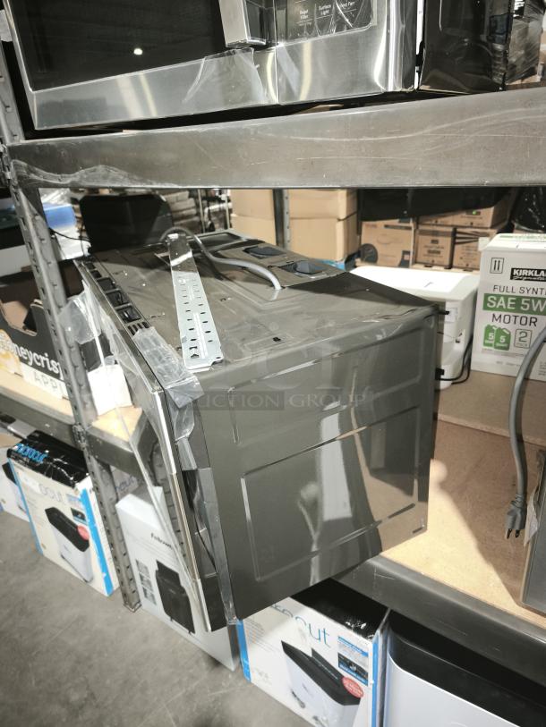 BRAND NEW SCRATCH AND DENT - GE Profile 2.1 cu ft Over-the-Range Sensor Microwave Oven, Model PVM9005SJ8SS, minor surface damage.