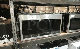 BRAND NEW SCRATCH AND DENT - GE Profile 2.1 cu ft Over-the-Range Sensor Microwave Model PVM9005SJ8SS, stainless steel finish, with visible label, minor dents.