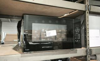 BRAND NEW GE Profile 2.2 Cu. Ft. Sensor Microwave, Model PCWK22U1WBB, on shelf with minor scratches.