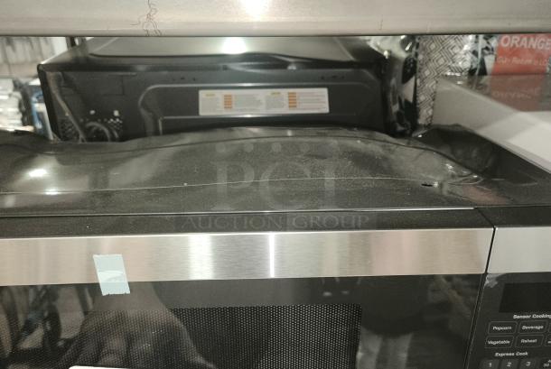 BRAND NEW GE Profile™ 1.1 cu. ft. Countertop Microwave, Model PCHK11S1WSS. Scratch and dent condition with visible imperfections.