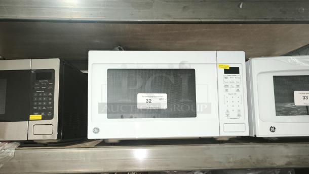 Brand new GE 1.1 Cu. Ft. Countertop Microwave, Model GCST11N1WWW. Scratch and dent unit with keypad and turntable.