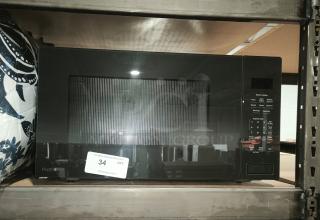 BRAND NEW SCRATCH AND DENT GE Profile 2.2 cu ft built-in sensor microwave oven, model PCWK22U1WDD. Visible control panel.