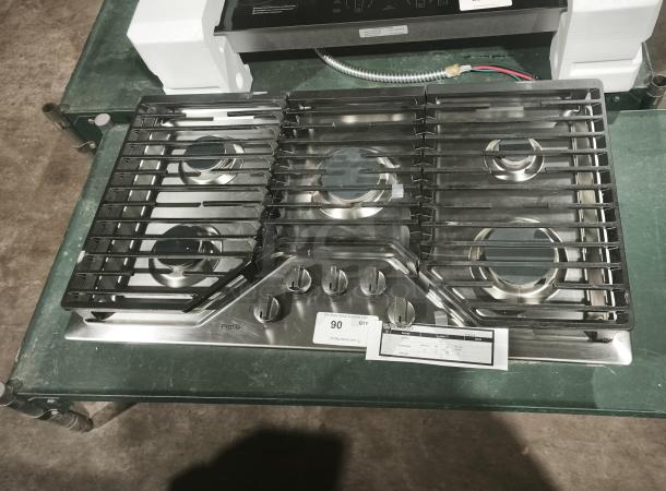 Profile 36" gas cooktop, stainless steel, model PGP7036SLSS, like new, 5 burners, including power boil. Visible labels.