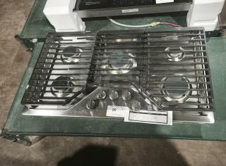 Profile 36" gas cooktop, stainless steel, model PGP7036SLSS, like new, 5 burners, including power boil. Visible labels.