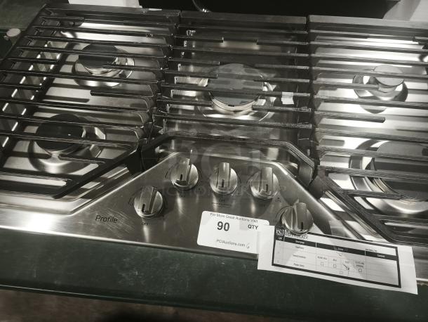 Profile PGP7036SLSS 36" gas cooktop, stainless steel, five burners including Power Boil, like new condition, visible control knobs.