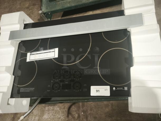 BRAND NEW CAFÉ™ Series 36" induction cooktop, model CHP90361TBB. Features touch controls, ENERGY STAR® certified.