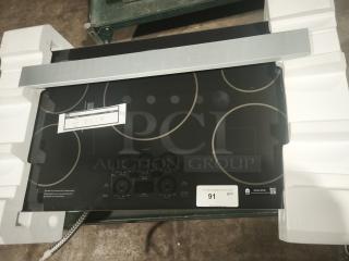 BRAND NEW CAFÉ™ Series 36" induction cooktop, model CHP90361TBB. Features touch controls, ENERGY STAR® certified.