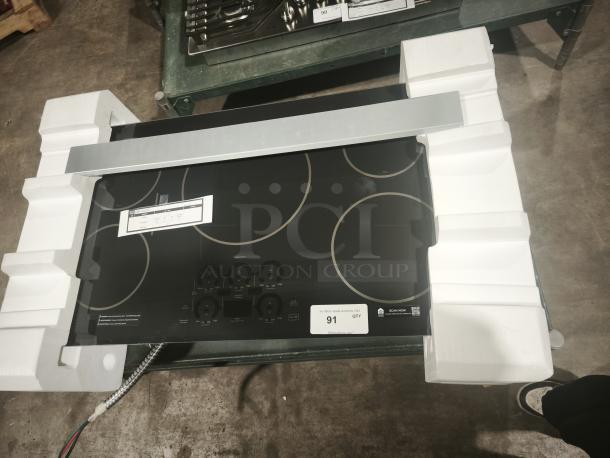 BRAND NEW CAFÉ™ Series 36" Induction Cooktop, Model CHP90361TBB. Energy Star rated, touch controls, black finish.