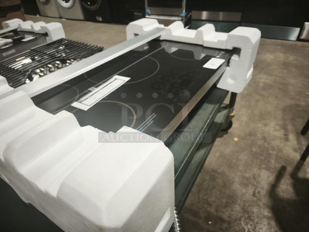 BRAND NEW CAFÉ™ Series 36" Built-In Induction Cooktop, model CHP90361TBB, in packaging with protective foam.