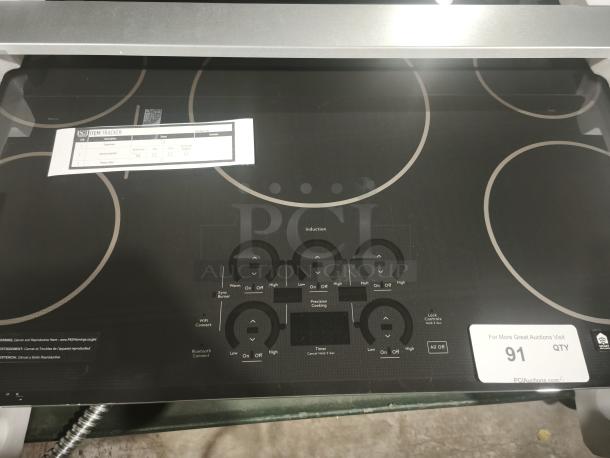 BRAND NEW CAFÉ Series CHP90361TBB 36" induction cooktop, built-in, touch control, ENERGY STAR®, visible controls and labels.
