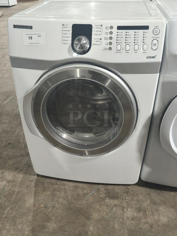 Samsung 7.3 cu ft electric steam dryer, model DV407AEW/XAA, in working condition. Features include multiple drying cycles and steam refresh.
