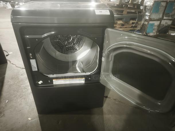 GE Profile Smart Electric Dryer, model PTD70EBPT1DG, 7.4 cu. ft. capacity, front-load, Steam & Sanitize, open door view.