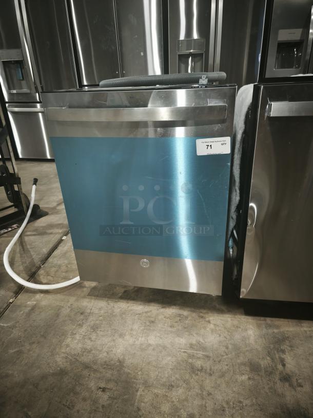 New GE GDT550PYRFS dishwasher, top control, plastic interior, sanitize cycle, Dry Boost. Stainless steel, auction tag visible.
