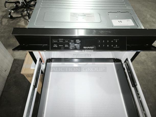 Brand new Sharp Smart Microwave Drawer, model SMD2489ES, with digital touchpad and sensor cooking features visible.