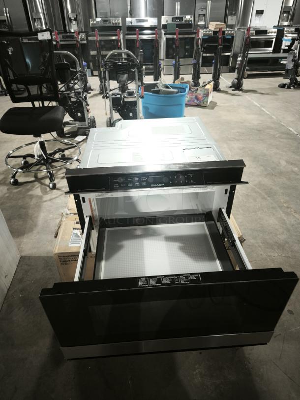 Brand new Sharp Smart Microwave Drawer, Model SMD2489ES, open view showcasing interior and control panel.