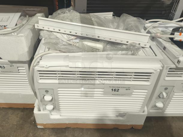 GE 5000 BTU window air conditioner AWFS05BWL for small rooms, brand new with scratch and dent, includes installation kit.