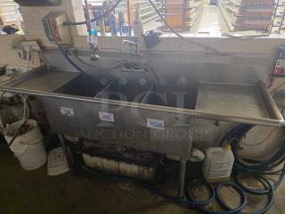 Stainless steel 3 compartment sink with faucet, Sanitary Equipment Co. labels, in used condition.