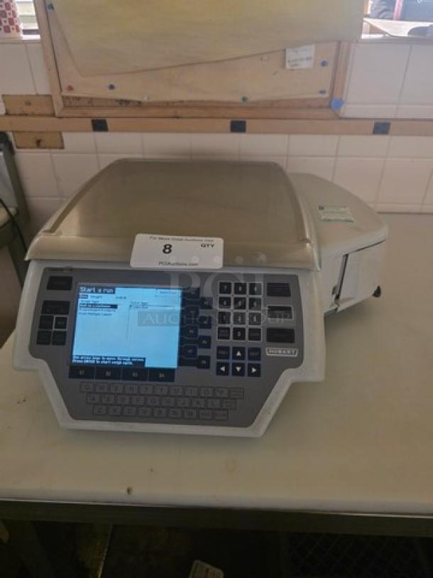 Hobart Quantum Scale with digital display and keypad, model label visible, in used condition on a counter.