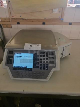 Hobart Quantum Scale with digital display and keypad, model label visible, in used condition on a counter.