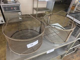Lot of 2 round fry baskets with wire mesh design and metal handles. Visible numbered stickers "15" and "16." Used condition.