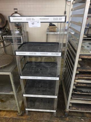 5-tier rolling shelf with "Woodbridge Black Box" branding, transparent sides, and black shelves. Used condition.