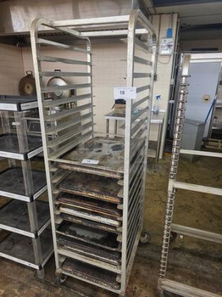 Metal sheet pan rack with multiple slots for holding pans. Used condition, wheels for mobility. Label shows "18".