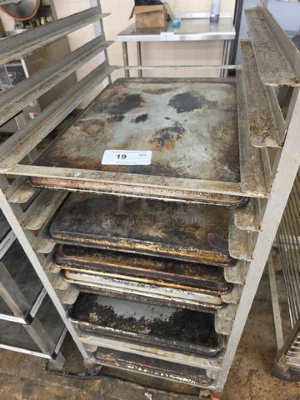 Lot of 10 full-size sheet pans, used condition, visible wear and discoloration; rack not included.