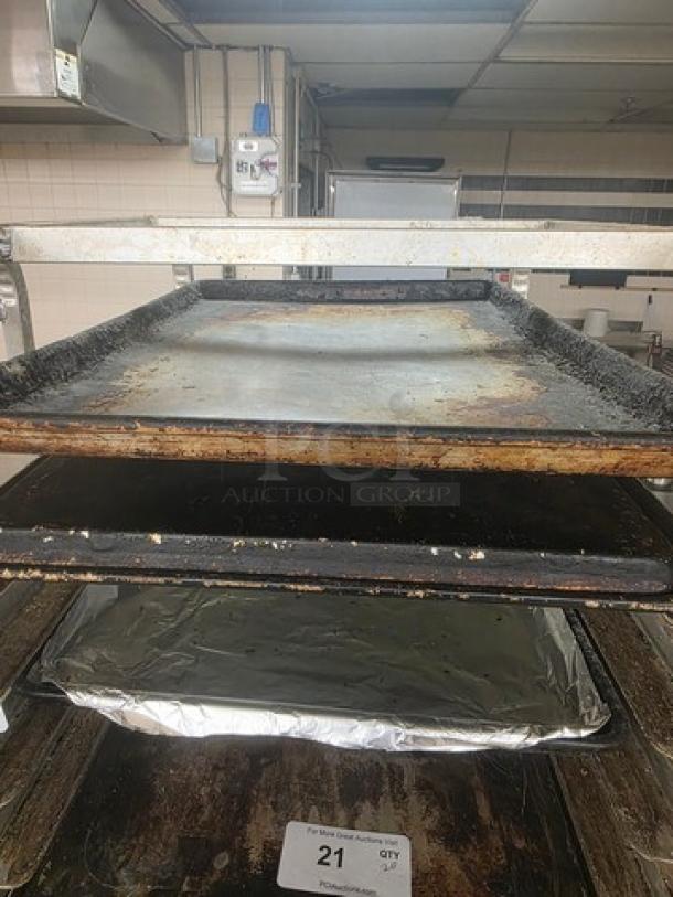 Lot of 20 full-size sheet pans; used condition with visible wear. Rack not included. Tag shows item number 21.