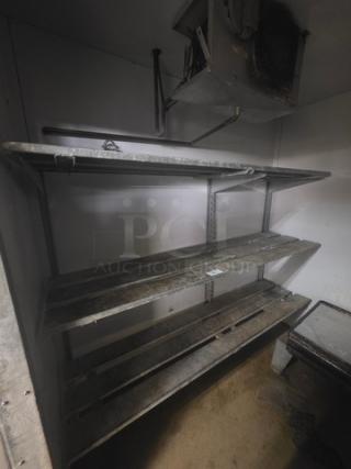 Lot of 2 wall-mountable shelving units for walk-in cooler or freezer, metal construction, good condition, buyer removal required.