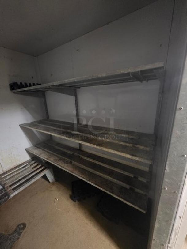 Lot of 2 wall-mount shelving units for walk-in cooler/freezer, metal construction, used condition, buyer to remove.