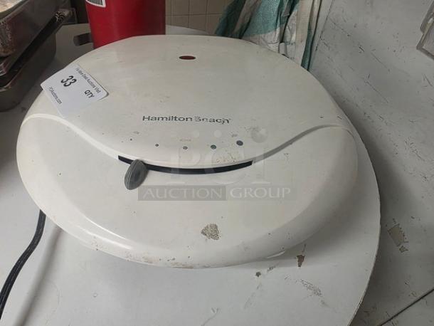 Hamilton Beach HealthSmart Contact Grill, white, shows signs of wear. Visible logo and controls on top. Auction tag attached.