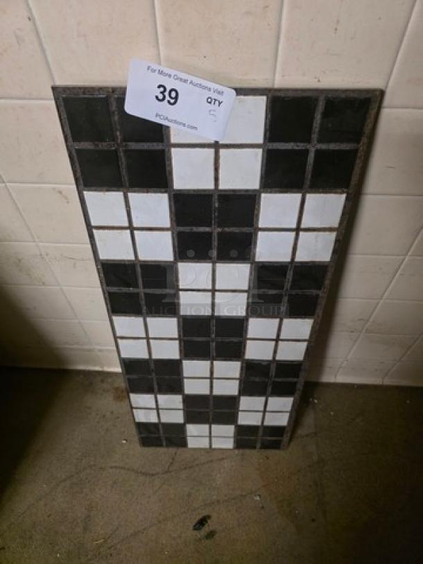 Lot of 5 tile pieces featuring a black and white checker pattern. Each tile piece is intact and laid out for display.