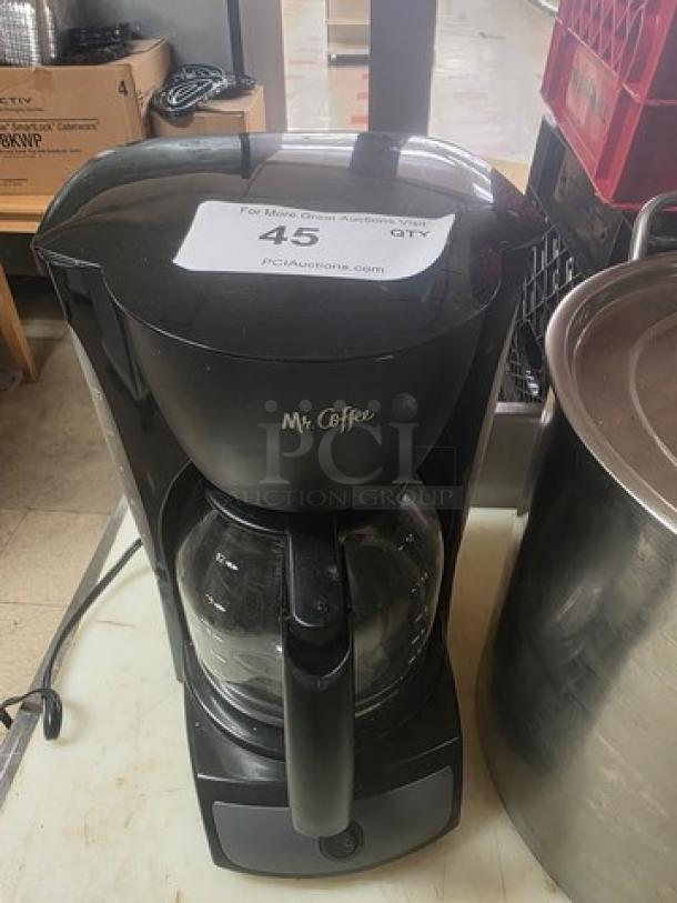Mr. Coffee 12-Cup Switch Coffeemaker, black, glass carafe, good condition, model displayed.