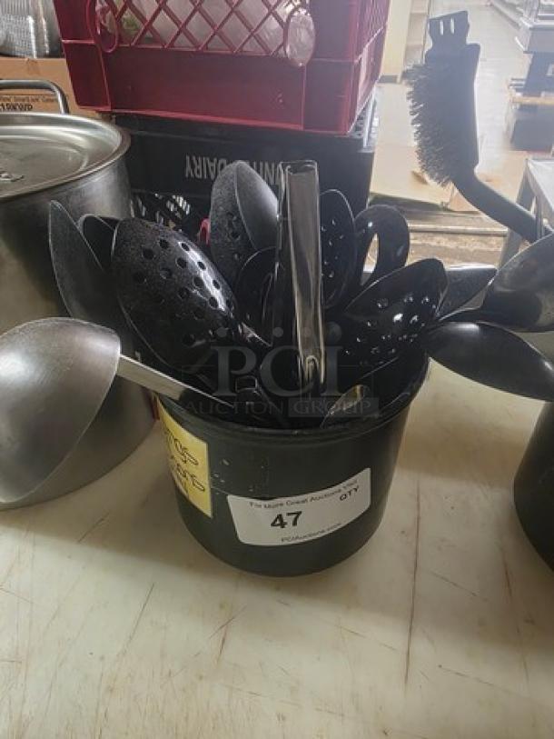 Lot of miscellaneous kitchenware including black plastic utensils in a metal container, label marked "47."