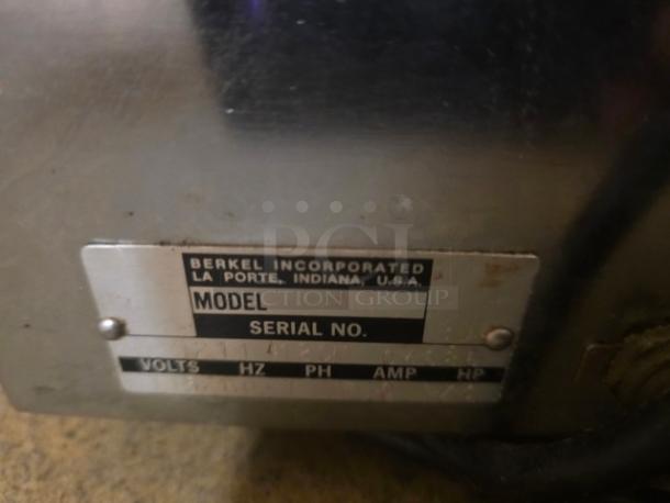 Berkel MB Series countertop bread slicer, 115V, 60 Hz, 1 PH. Label shows model and voltage specs. Used condition.