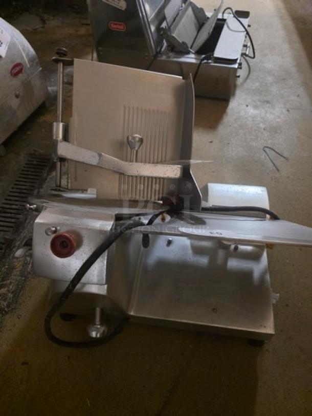 Fleetwood Deli Slicer Model 412, silver finish, 115V, used condition, visible power cord, suitable for professional use.