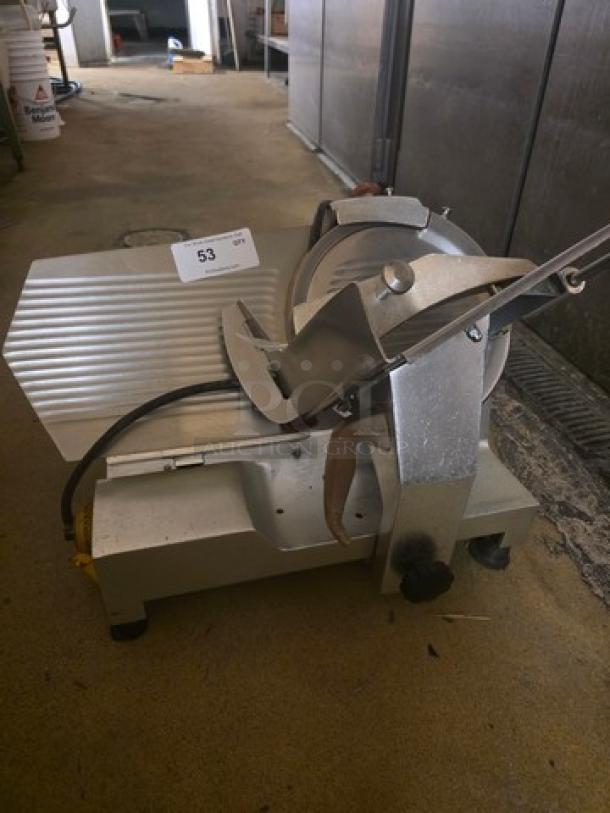 Fleetwood Deli Slicer Model 412, 115V/60Hz/1PH, metallic finish, used condition, visible tag displaying model number.